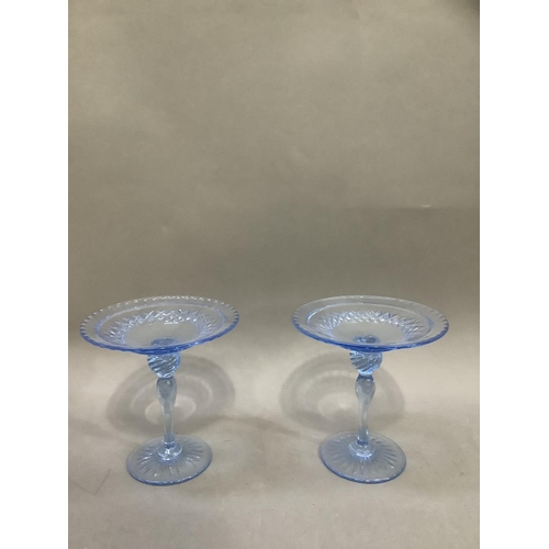 97 - A pair of pale blue cut glass sweetmeat pedestal dishes with moulded stems, 16cm high