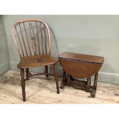 321 - An oak drop leaf gate legged occasional table and an elm kitchen chair