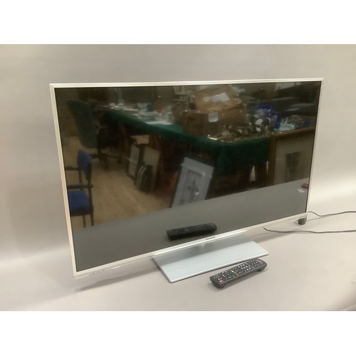 157 - A Panasonic flat screen TV on a stand