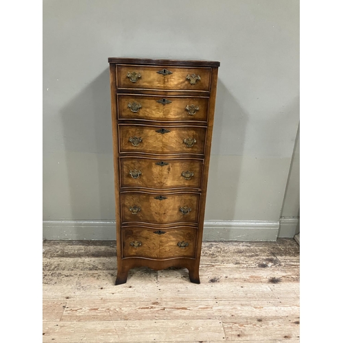 307 - A walnut chest of six drawers having a serpentine front on bracket feet, 46cm wide