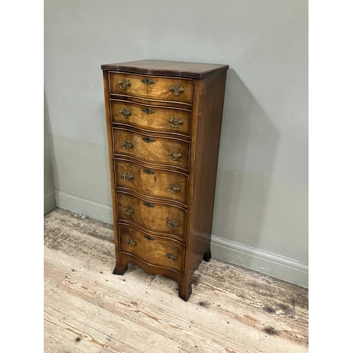 307 - A walnut chest of six drawers having a serpentine front on bracket feet, 46cm wide