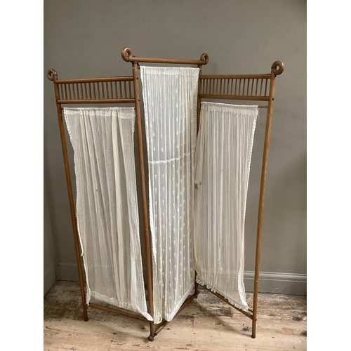 308 - An Aesthetic movement bamboo three-fold room screen with panels of netting