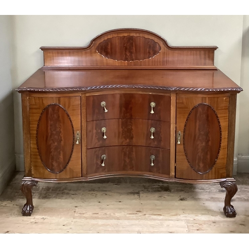 341 - A mahogany sideboard with semi-arched raised back, gadroon rim over three concave drawers flanked by... 