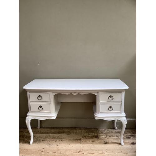 357 - A cream painted serpentine fronted dressing table having two drawers to either side of a kneehols, o... 