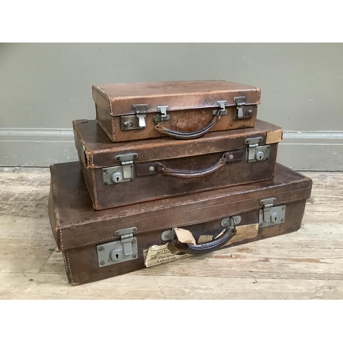 358 - Three leather suitcases of graduated size