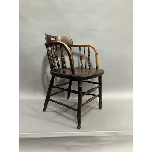 370 - A 20th century oak office chair on turned legs with turned stretchers