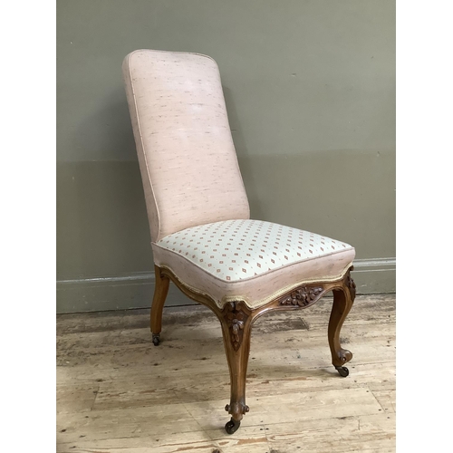 385 - A Victorian single chair with upholstered back and seat foliate carved cabriole legs with knurled fe... 