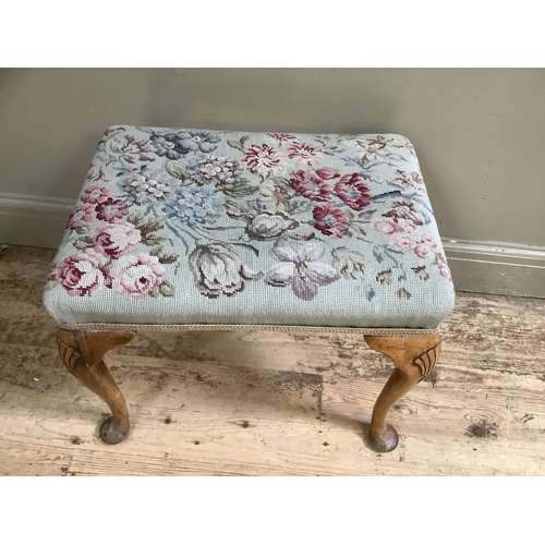 387 - A walnut dressing stool on cabriole legs with shell carvings to the shoulder with tapestry upholster... 