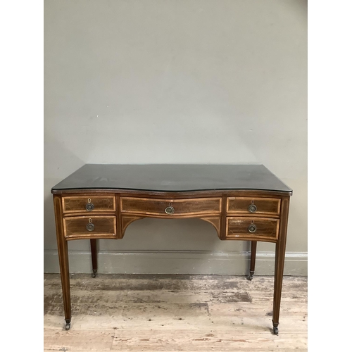 389 - An Edwardian mahogany crossbanded dressing table, with serpentine front having a long drawer to the ... 