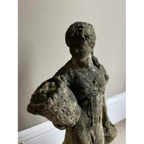 395 - A cast garden sculpture of a woman in a dress carrying baskets of flowers, 76cm high