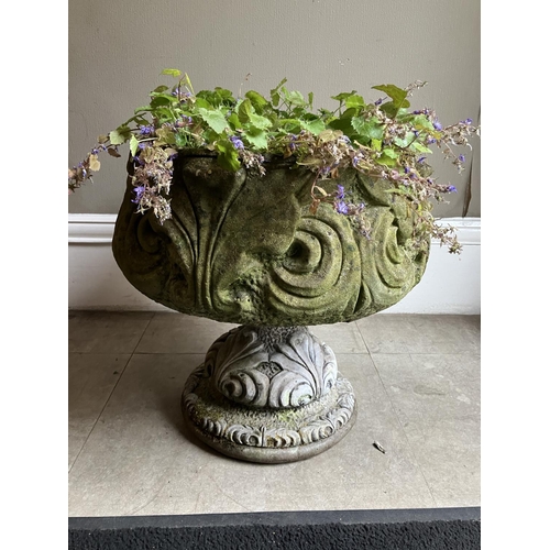 396 - A cast garden planter on pedestal foot, 47cm high