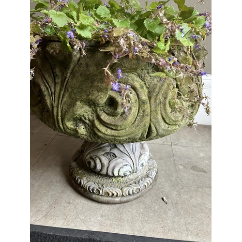 396 - A cast garden planter on pedestal foot, 47cm high