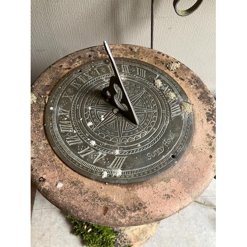 400 - A sundial on terracotta plinth together with a garden plant stand