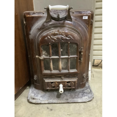 391 - A cast iron and glazed ceramic stove