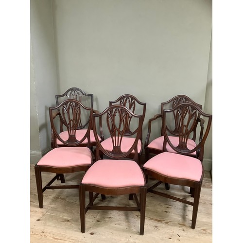 390 - Six  mahogany shield back dining chairs, serpentine seat rail, upholstered seat on fluted tapered le... 