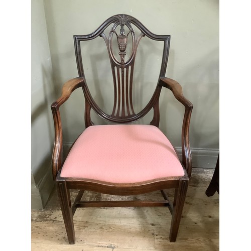 390 - Six  mahogany shield back dining chairs, serpentine seat rail, upholstered seat on fluted tapered le... 