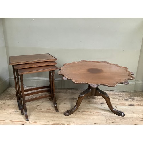 372 - A mahogany tilt top table of scalloped outline with gadroon amd shell rims, on three leaf carved cab... 