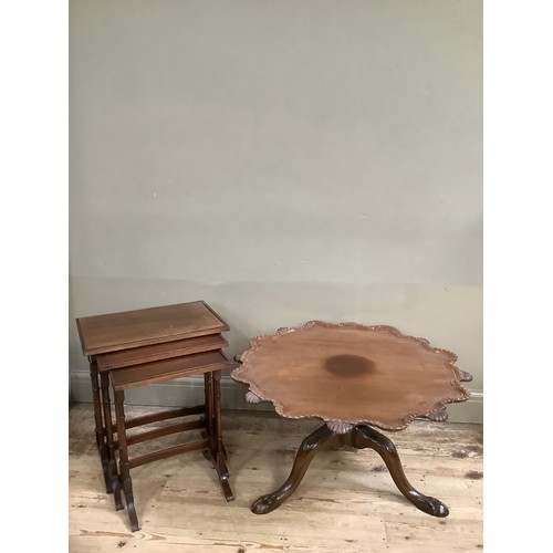 372 - A mahogany tilt top table of scalloped outline with gadroon amd shell rims, on three leaf carved cab... 