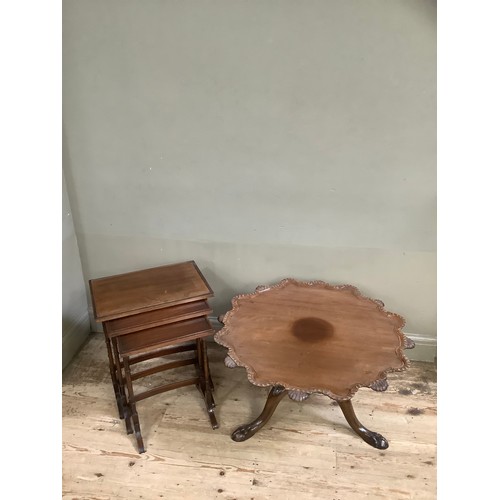 372 - A mahogany tilt top table of scalloped outline with gadroon amd shell rims, on three leaf carved cab... 