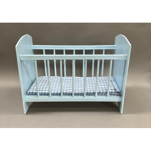 160 - A doll's cot in duck egg blue painted with flowers