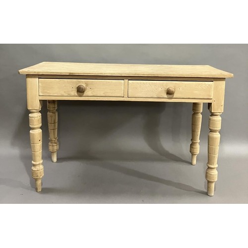 167 - A stripped pine kitchen table having two drawers on turned legs 120cm wide x 49cm deep x 76cm high