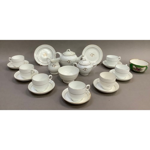 192 - A Victorian dolls tea service, with gilt detailing on white, the teapot, sugar bowl and milk jug hav... 