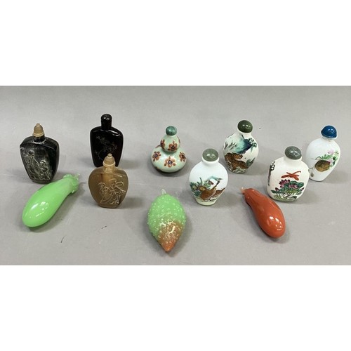 214 - A collection of eleven modern Chinese snuff bottles, in porcelain, agate etc