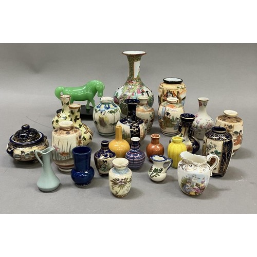 229 - A Chinese famille rose bottle neck vase, 12cm high together with a collection of 23 miniature vases ... 