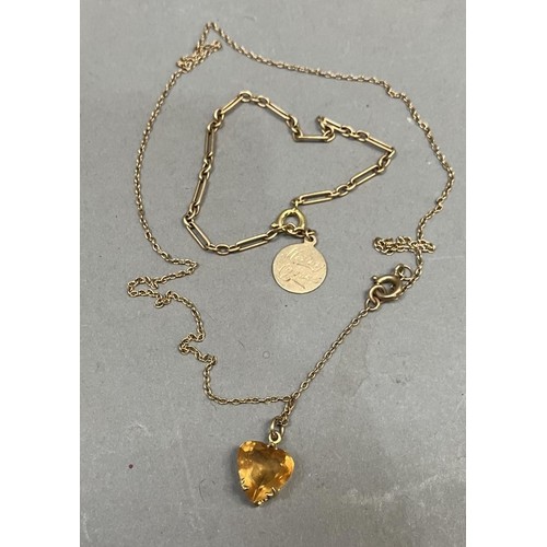 267 - A heart-shaped citrine pendant claw set in 9ct gold gallery mount hung on a fine trace link chain to... 