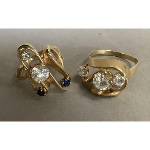 277 - Two dress rings set with cubic zirconia and sapphire, the circular facetted stones claw set within a... 