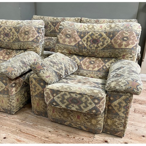 346 - A three seater sofa with two armchairs upholstered in Aztec style fabric