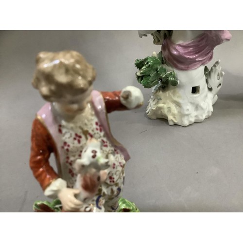 92 - A pair of English Derby figures of a boy and girl with dog and puppy together with a later figure of... 