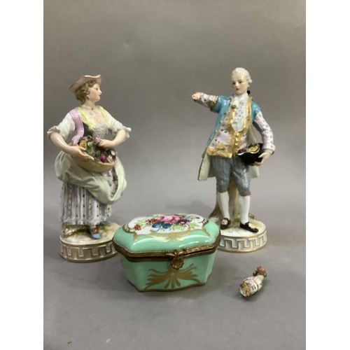 95 - A pair of early 19th century continental porcelain figures of a lady and gentleman in contemporary d... 