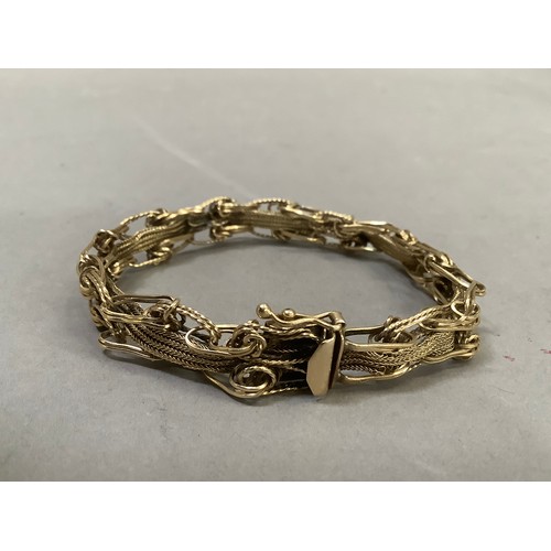 292 - A bracelet in foxtail chain and wire links in yellow metal (tests as 14ct gold), approx. length 19.5... 