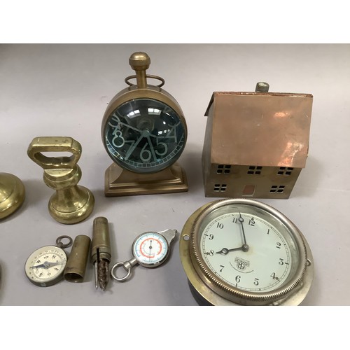 228 - A Smith's of Cricklewood car clock, a set of four brass weights, a desk clock formed as a compass, a... 