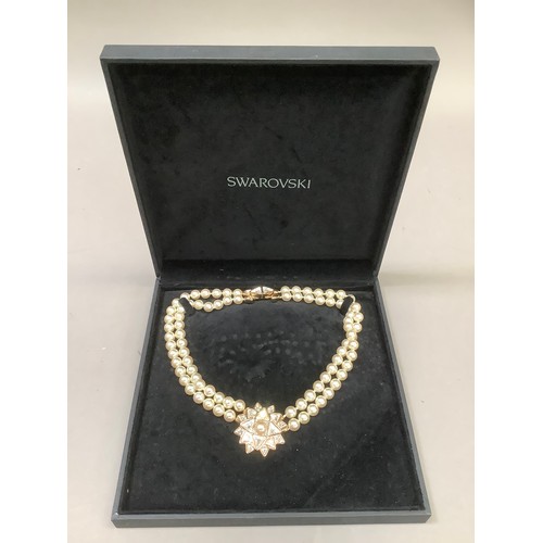 268B - A necklace signed for Swarovski in base metal set with simulated pearls and colourless pastes, appro... 