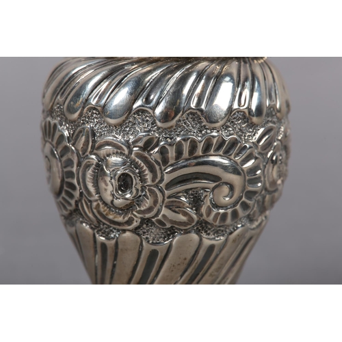 403 - A Victorian silver muffineer, London 1892 for Samuel Jacob, wrythen chased with foliate band over we... 