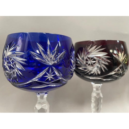 39 - A set of six cut glass hock glasses, the bowls in various colours, 19.5cm high