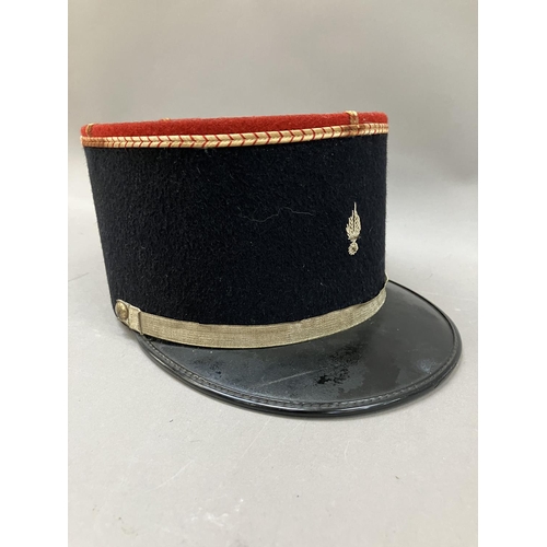 440 - A French military Kepi with red top and gilt embroidery, 11cm high