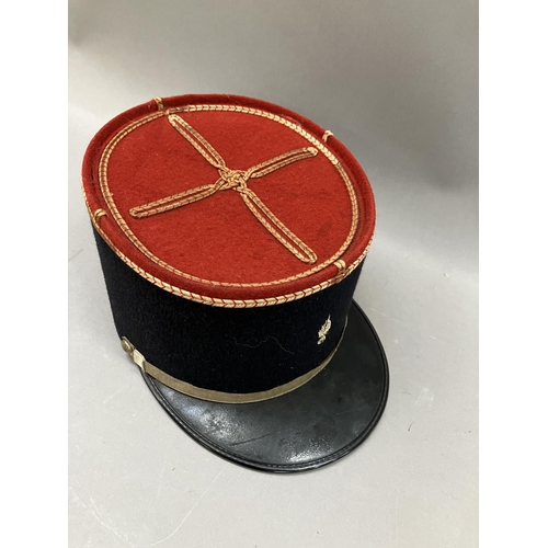 440 - A French military Kepi with red top and gilt embroidery, 11cm high