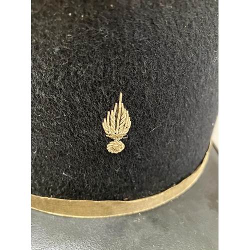 440 - A French military Kepi with red top and gilt embroidery, 11cm high