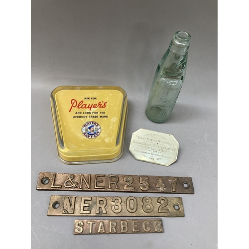 454 - A Player’s ashtray, three railway plaques and a Harston & Co marble bottle