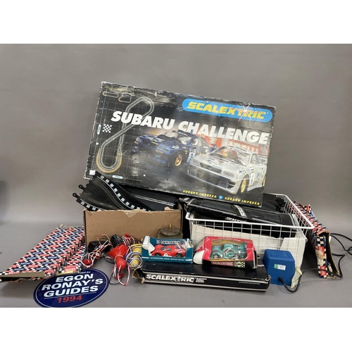 487 - A Scalextric Subaru Challenge together with a collection of slot racing track some boxed