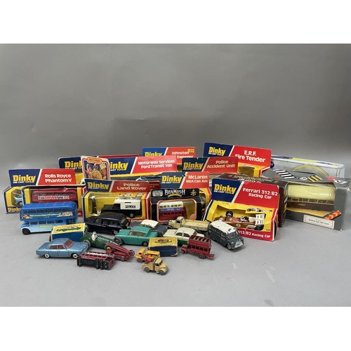 489 - A collection of vintage Dinky Die Cast toys including E.R.F Fire Tender, McLaren, together with a Co... 