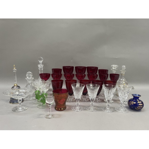 48 - A collection of glassware including four decanters, one ring cut and another gilt decorated, ruby wi... 