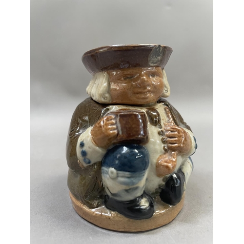 29 - A Royal Doulton Lambeth honest measure inkwell, together with a flagon, vase and a bowl, 7cm high