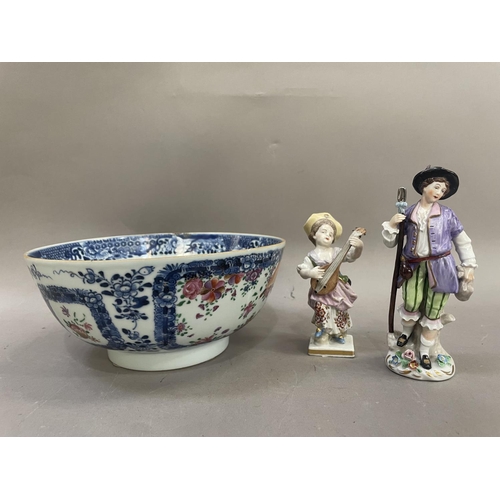 23 - A continental porcelain figure of a girl with a mandolin and another of a traveller 14cm high togeth... 