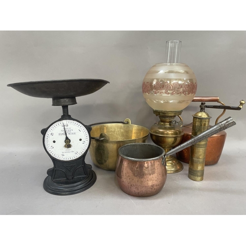 60 - A brass etched pepper grinder, a set of Salters scales together with a brass oil lamp with etched sh... 