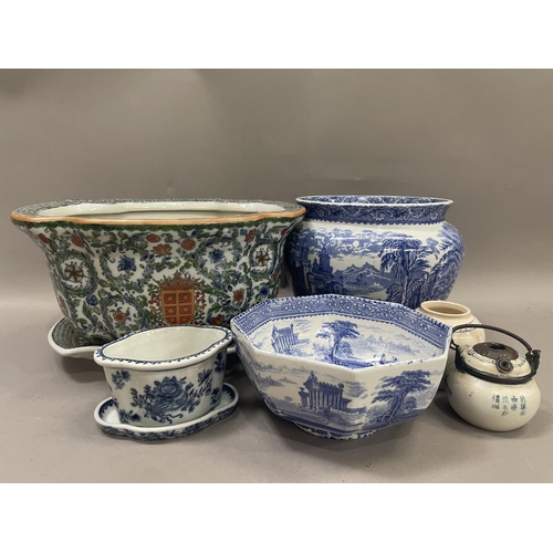 64 - A polychrome jardiniere and stand with armorial crest, a 19th century blue and white bowl, another j... 