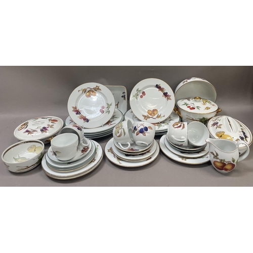 61 - A collection of Royal Worcester Evesham tableware comprising serving dishes, tureens plates, cups an... 